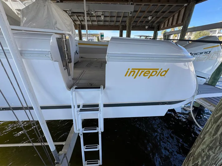  Yacht Photos Pics 2020 Intrepid 407 Cuddy boat docked with ladder access.