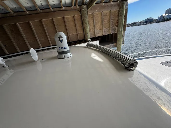  Yacht Photos Pics 2020 Intrepid 407 Cuddy boat roof with FLIR system, docked by the water.
