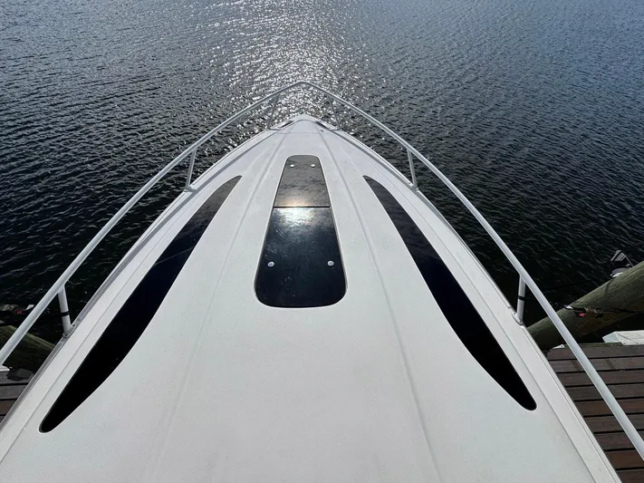  Yacht Photos Pics Bow view of 2020 Intrepid 407 Cuddy boat on water.