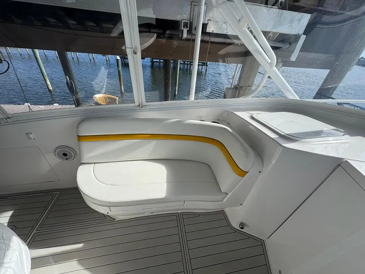  Yacht Photos Pics 2020 Intrepid 407 Cuddy interior with white and yellow seating, dockside view.
