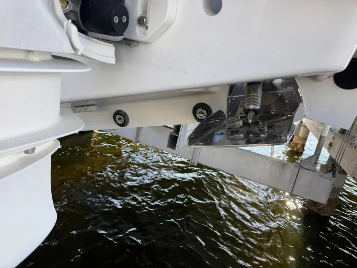  Yacht Photos Pics 2020 Intrepid 407 Cuddy boat underside, showing propeller and water reflection.