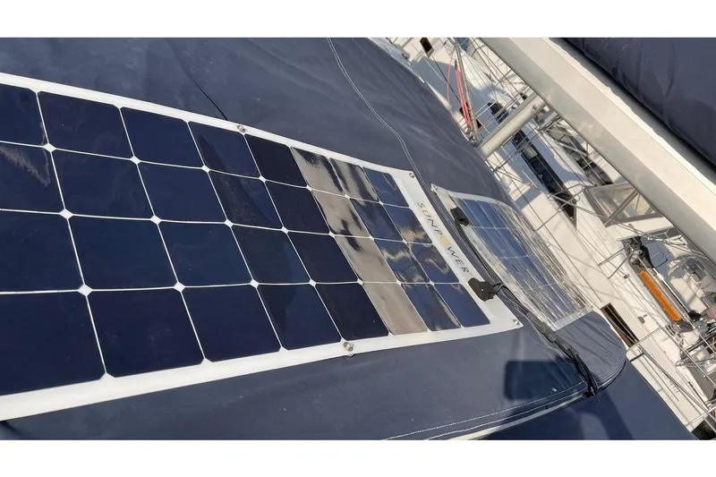 Yacht Photos Pics Solar panels on a 1999 Hunter 410 sailboat deck, providing renewable energy.