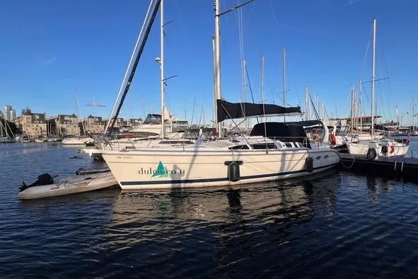  Yacht Photos Pics Sailboat docked in marina, 1999 Hunter 410 model, clear blue sky.