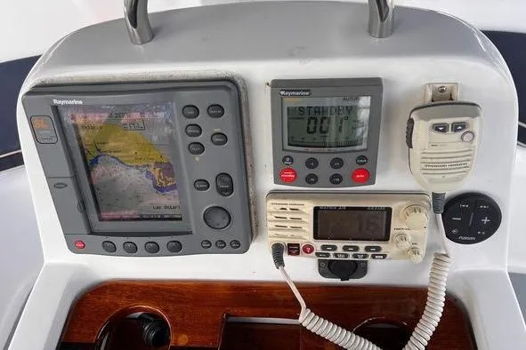  Yacht Photos Pics 1999 Hunter 410 sailboat navigation panel with Raymarine instruments and communication devices.