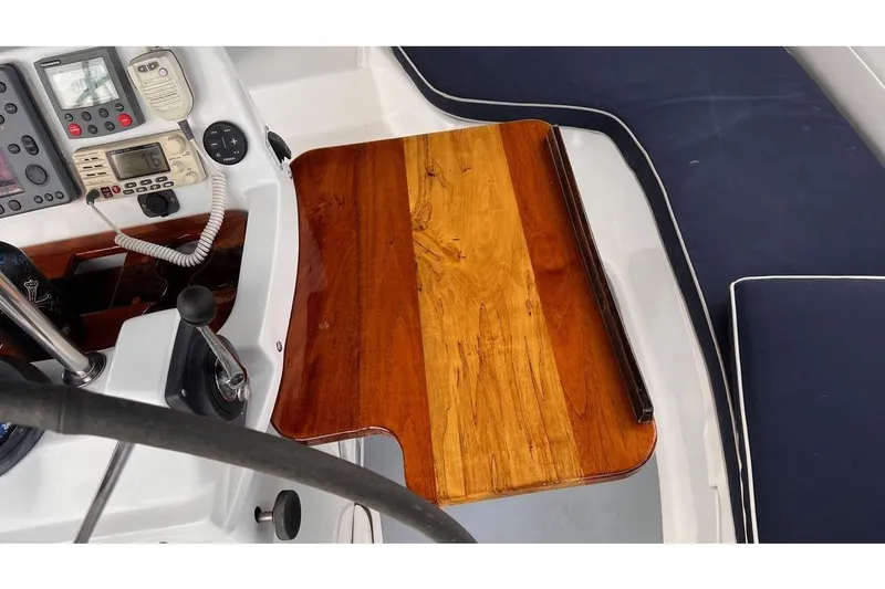  Yacht Photos Pics Cockpit of 1999 Hunter 410 sailboat with wooden table and navigation instruments.