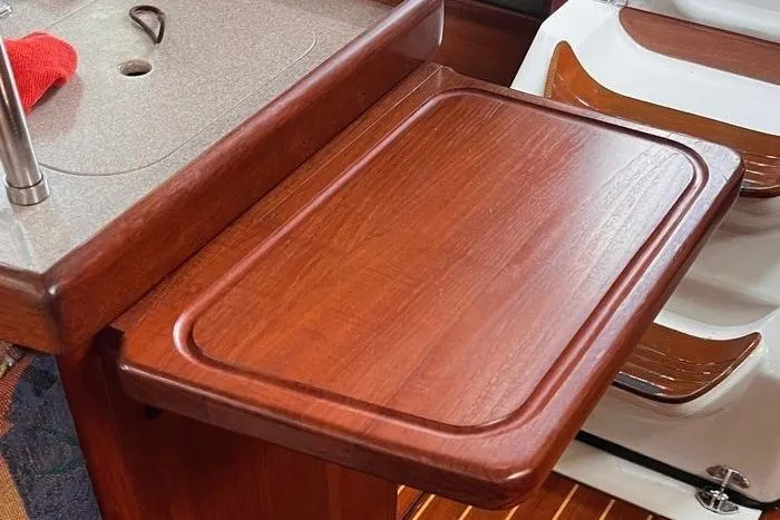  Yacht Photos Pics Wooden countertop in a 1999 Hunter 410 sailboat kitchen area.