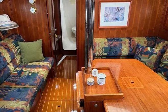  Yacht Photos Pics Interior of 1999 Hunter 410 sailboat with wood finish and colorful seating.