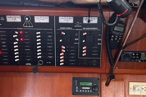  Yacht Photos Pics Electrical control panel on a 1999 Hunter 410 boat with various switches and meters.