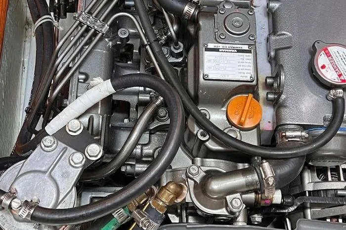  Yacht Photos Pics Engine components of a 1999 Hunter 410 boat, showcasing intricate mechanical details.