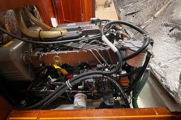  Yacht Photos Pics Engine compartment of a 1999 Hunter 410 sailboat, showcasing detailed mechanical components.