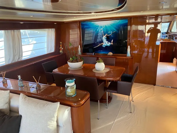 My Sons Yacht Photos Pics Luxurious interior of a 2008 Falcon 86 yacht with elegant dining area and modern decor.