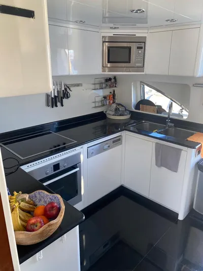 My Sons Yacht Photos Pics Modern kitchen in 2008 Falcon 86 yacht with sleek appliances and fruit basket.