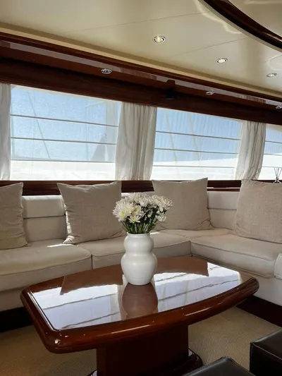 My Sons Yacht Photos Pics Luxurious Falcon 86 yacht interior with elegant seating and floral centerpiece, 2008 model.