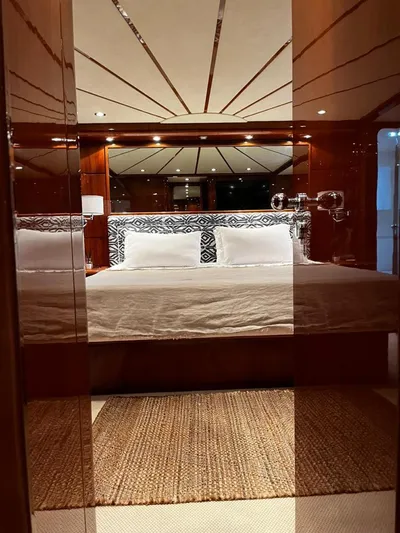 My Sons Yacht Photos Pics Luxurious bedroom interior on Falcon 86 yacht, 2008 model, featuring elegant wood paneling and plush bedding.