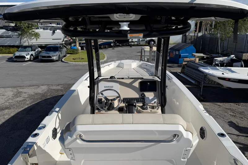  Yacht Photos Pics 2023 Boston Whaler 280 Dauntless boat interior with steering console and seating.