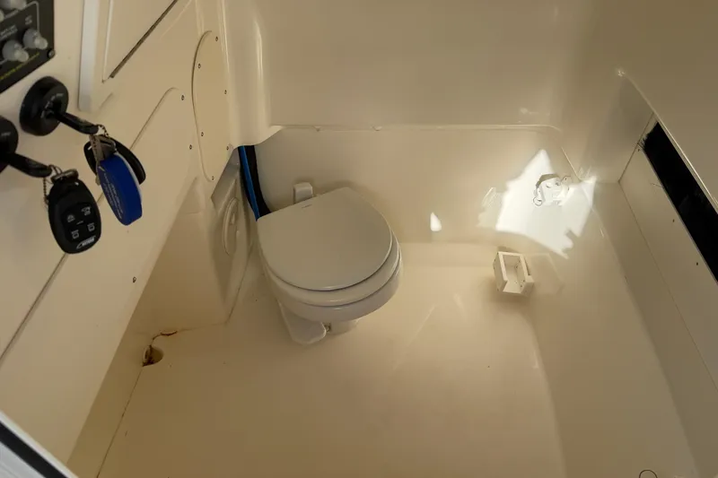  Yacht Photos Pics Interior of 2023 Boston Whaler 280 Dauntless boat featuring a compact marine toilet.
