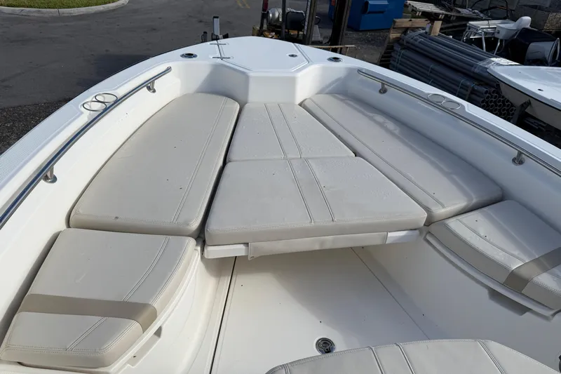  Yacht Photos Pics 2023 Boston Whaler 280 Dauntless boat interior with cushioned seating area.
