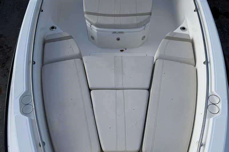  Yacht Photos Pics 2023 Boston Whaler 280 Dauntless boat interior with cushioned seating area.