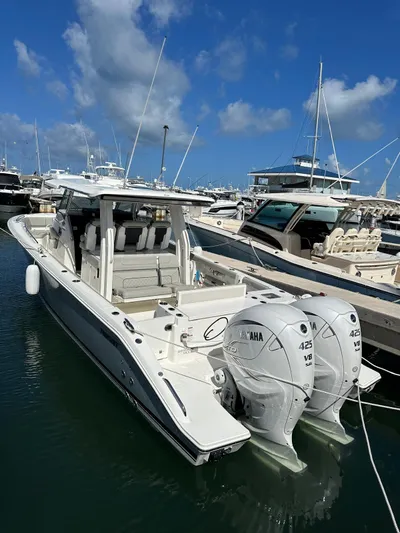  Yacht Photos Pics 2023 Pursuit S 358 Sport boat docked with twin Yamaha engines.