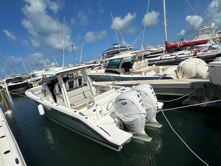  Yacht Photos Pics 2023 Pursuit S 358 Sport boat docked in marina with twin Yamaha engines.