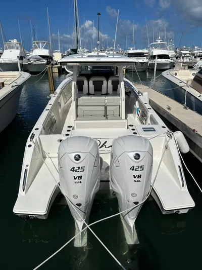  Yacht Photos Pics 2023 Pursuit S 358 Sport boat with twin 425 V8 engines docked in marina.