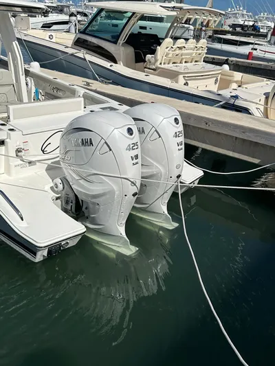  Yacht Photos Pics 2023 Pursuit S 358 Sport boat with twin Yamaha 425 V8 engines docked in marina.