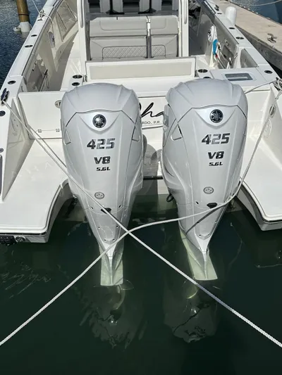  Yacht Photos Pics 2023 Pursuit S 358 Sport boat with twin 425 V8 engines docked in water.