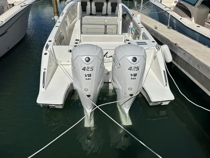  Yacht Photos Pics 2023 Pursuit S 358 Sport boat with twin 425 V8 engines docked in marina.