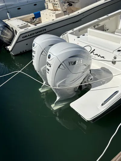  Yacht Photos Pics 2023 Pursuit S 358 Sport boat with twin Yamaha outboard engines docked.