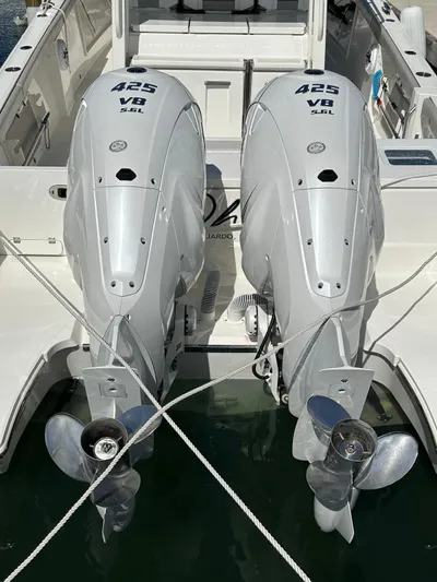  Yacht Photos Pics 2023 Pursuit S 358 Sport boat with twin 425 V8 engines, docked in water.