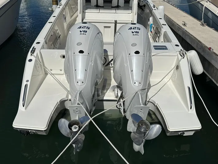 Yacht Photos Pics 2023 Pursuit S 358 Sport boat with twin 425 V8 engines docked at marina.
