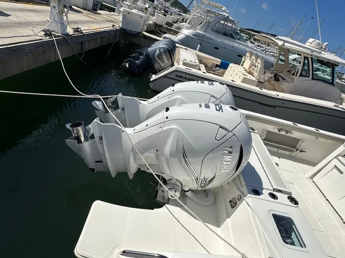  Yacht Photos Pics 2023 Pursuit S 358 Sport boat with Yamaha outboard engines docked at marina.