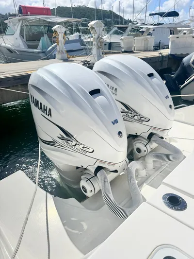  Yacht Photos Pics 2023 Pursuit S 358 Sport with twin Yamaha outboard engines at a marina.