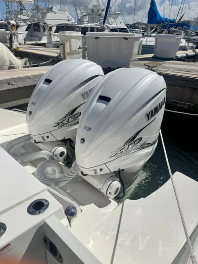  Yacht Photos Pics 2023 Pursuit S 358 Sport boat with twin Yamaha outboard engines at marina.