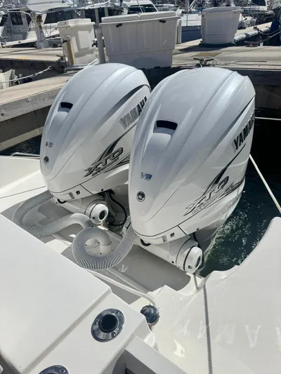  Yacht Photos Pics 2023 Pursuit S 358 Sport boat with twin Yamaha outboard engines at a marina.