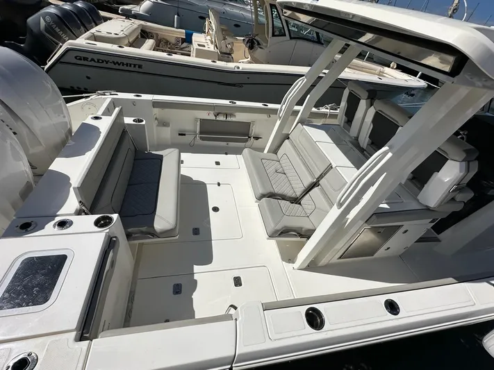  Yacht Photos Pics 2023 Pursuit S 358 Sport boat interior with spacious seating and modern design.