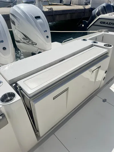  Yacht Photos Pics 2023 Pursuit S 358 Sport boat with Yamaha V8 engines at dock.