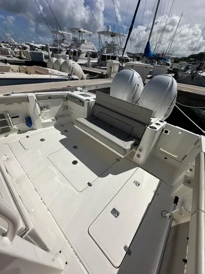  Yacht Photos Pics 2023 Pursuit S 358 Sport boat with dual engines docked at marina.