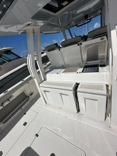  Yacht Photos Pics 2023 Pursuit S 358 Sport boat interior with sleek white design and modern amenities.