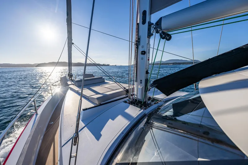 In Stock - W / Warranty Yacht Photos Pics Sailing on a 2024 Moody 41ds yacht under a clear blue sky.