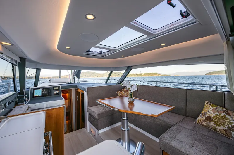 In Stock - W / Warranty Yacht Photos Pics Luxurious interior of 2024 Moody 41DS yacht with panoramic sea views.