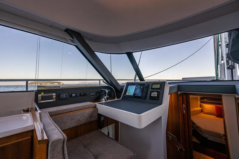 In Stock - W / Warranty Yacht Photos Pics 2024 Moody 41ds yacht interior with navigation controls and cozy cabin view.