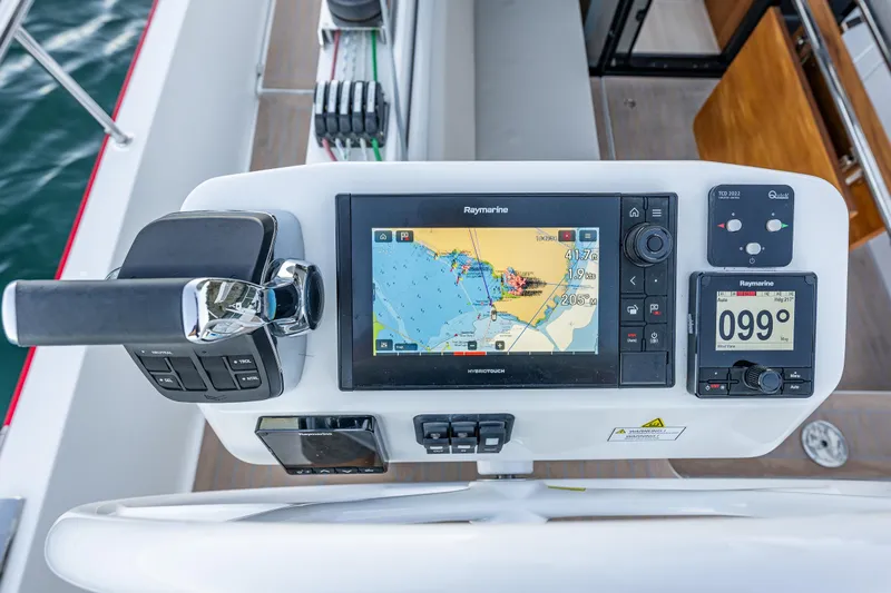 In Stock - W / Warranty Yacht Photos Pics Control panel of 2024 Moody 41ds yacht with navigation display and throttle.