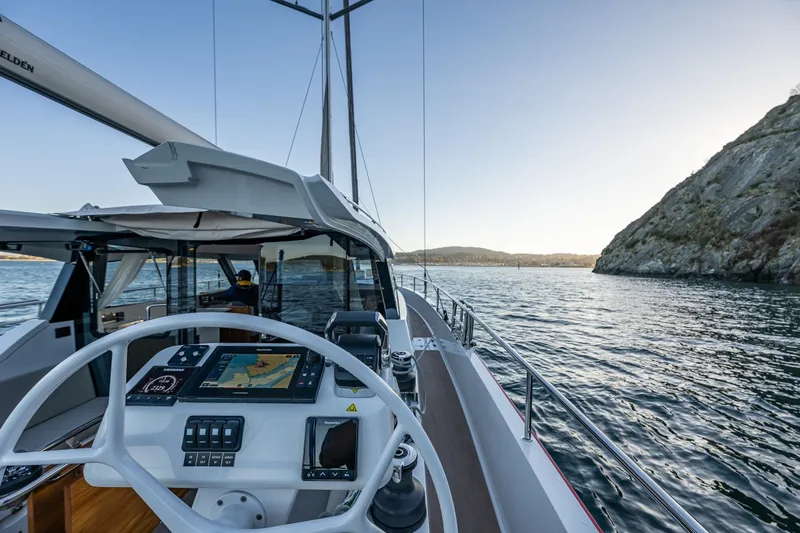 In Stock - W / Warranty Yacht Photos Pics 2024 Moody 41ds yacht steering wheel and navigation system on open water.