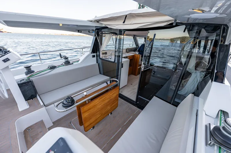 In Stock - W / Warranty Yacht Photos Pics Luxurious 2024 Moody 41ds yacht interior with spacious seating and ocean view.