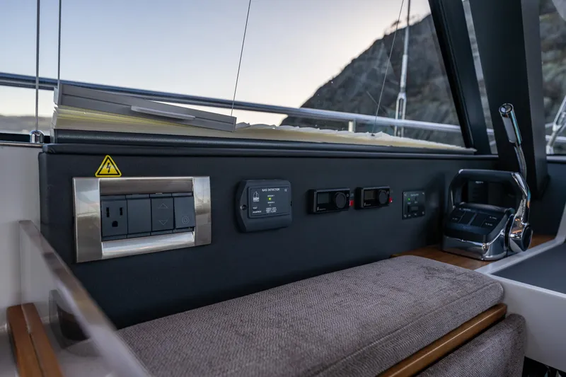 In Stock - W / Warranty Yacht Photos Pics Control panel and seating area on 2024 Moody 41ds yacht.