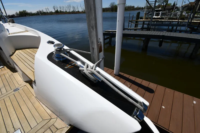 Loudmouth Soup Yacht Photos Pics Sunseeker 68 Predator 2002 yacht docked, showcasing sleek design and mooring details.