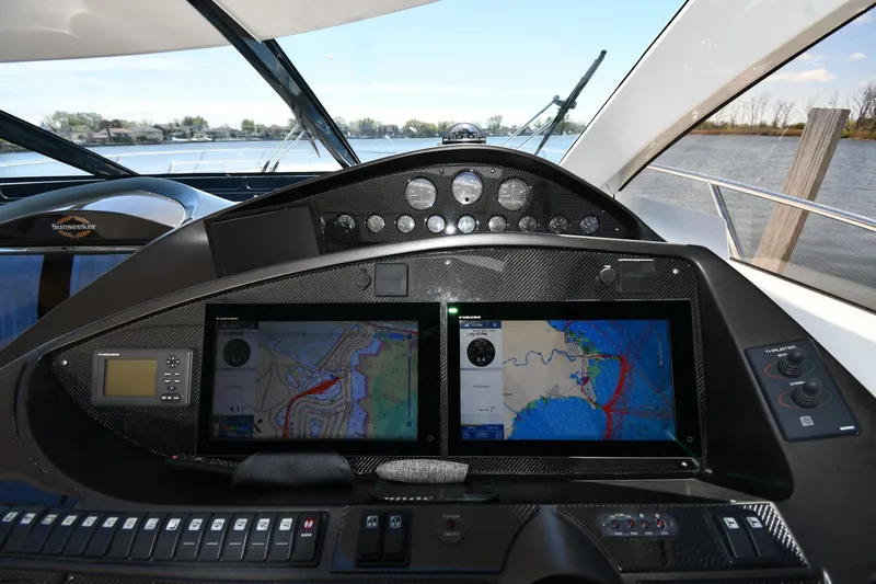 Loudmouth Soup Yacht Photos Pics Cockpit of 2002 Sunseeker 68 Predator yacht with navigation screens and controls.