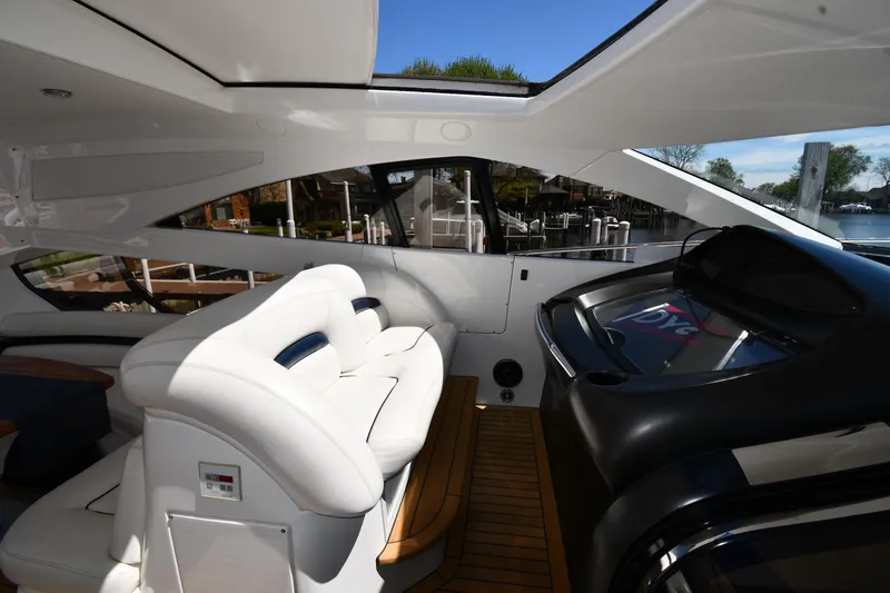 Loudmouth Soup Yacht Photos Pics Interior of 2002 Sunseeker 68 Predator yacht with white seating and sleek design.