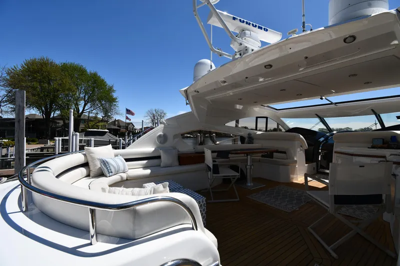 Loudmouth Soup Yacht Photos Pics Luxurious 2002 Sunseeker 68 Predator yacht with spacious outdoor seating and elegant design.